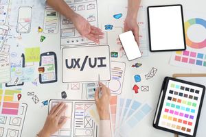 A designer planning a mobile app interface.