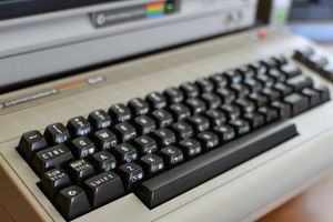 A vintage computer keyboard, close up in an office.